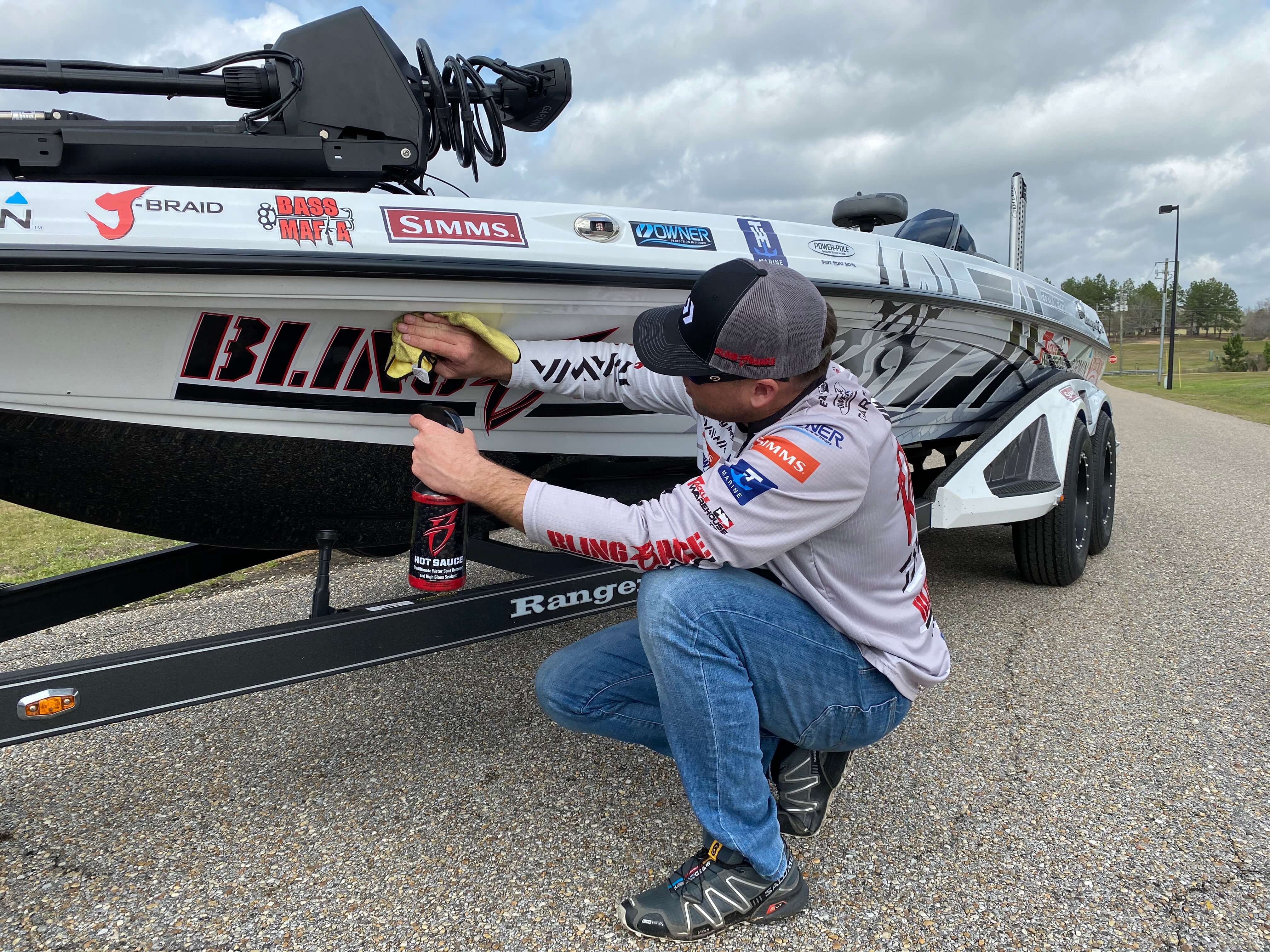 Cody Meyer cleaning a boat