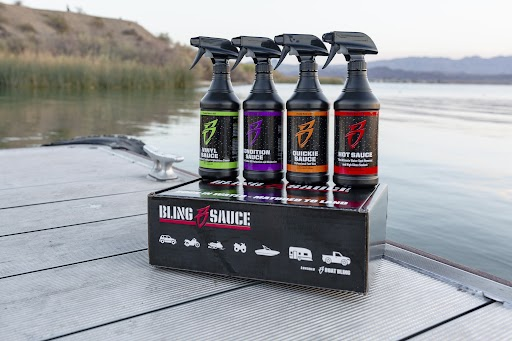 Bling Sauce 4-pack kit featuring four spray bottles on a dock by the water, showcasing various sauce types.