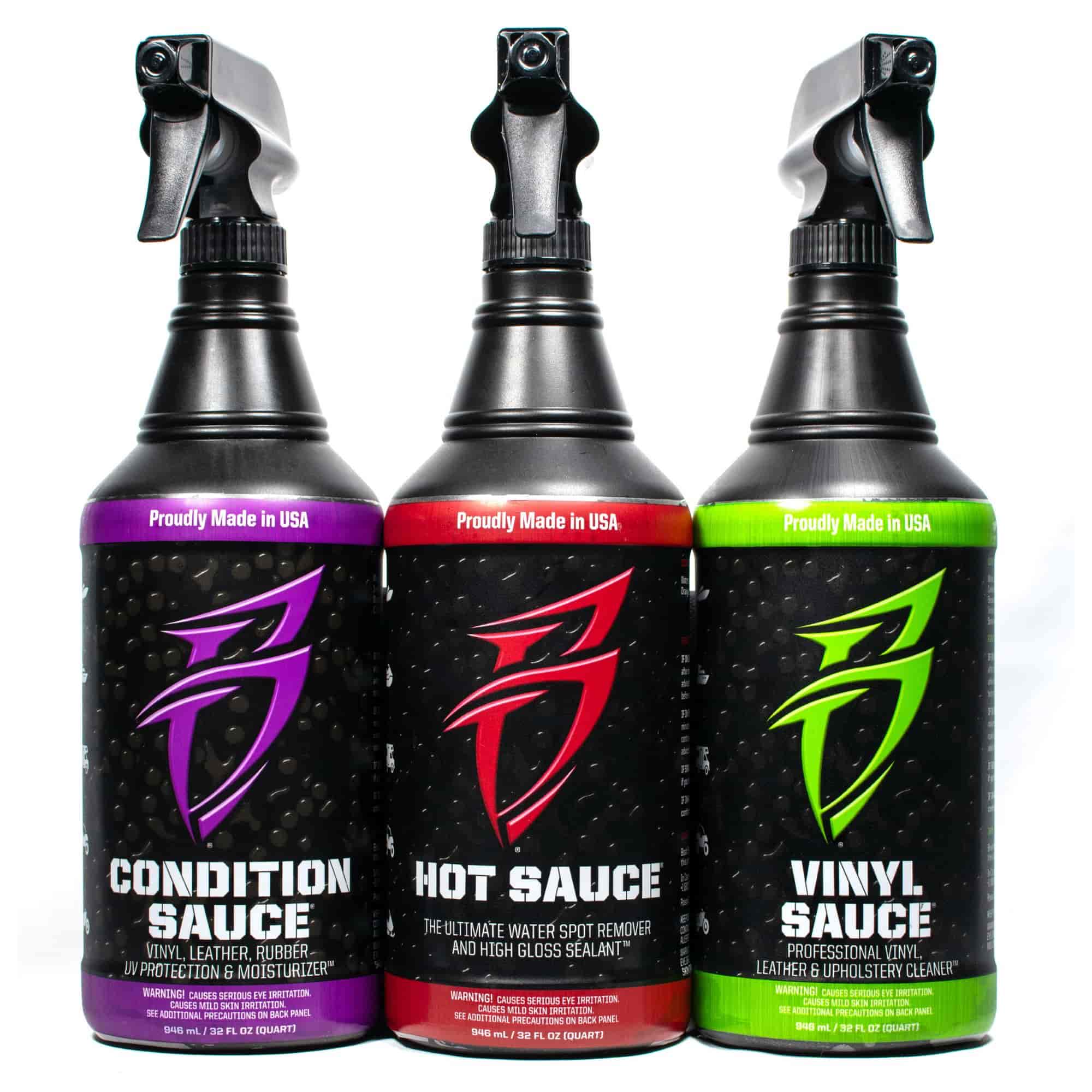Three spray bottles of Bling Sauce Threesome: Condition Sauce, Hot Sauce, and Vinyl Sauce, designed for vinyl and leather care.