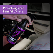 Condition Sauce spray bottle held in hand, designed to protect vehicle interiors from harmful UV rays.
