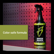 Green Sauce bottle on a reflective surface, featuring a color-safe formula for effective vehicle cleaning and detailing.