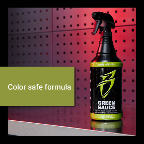 Green Sauce bottle on a reflective surface, featuring a color-safe formula for effective vehicle cleaning and detailing.