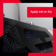 Close-up of a vehicle surface showing water droplets, illustrating the application of Hot Sauce for detailing.