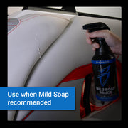 Mild Soap Sauce bottle held next to a car interior, highlighting its use for cleaning surfaces safely and effectively.
