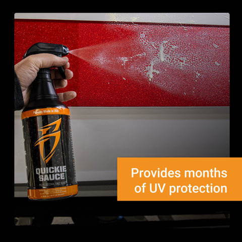 Hand holding a spray bottle of Quickie Sauce, applying a protective coating on a vehicle's surface for UV protection.