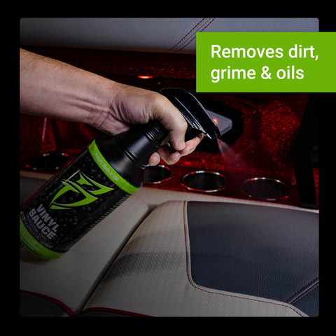 Vinyl Sauce spray bottle being used to clean dirt and grime from vehicle upholstery.