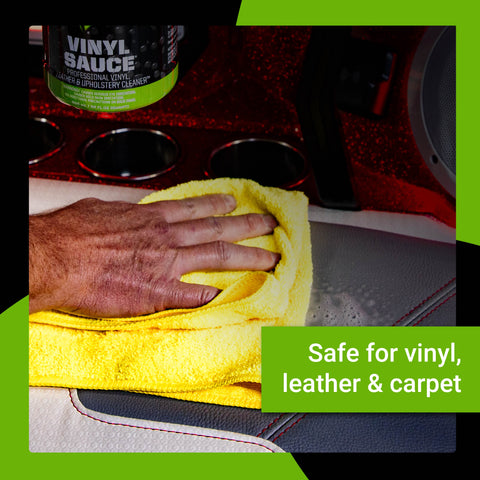 A hand using a yellow cloth to clean a vinyl surface with Vinyl Sauce, highlighting its safe use on vinyl, leather, and carpet.