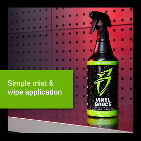 Vinyl Sauce bottle on a reflective surface, showcasing its mist and wipe application for cleaning vinyl surfaces.