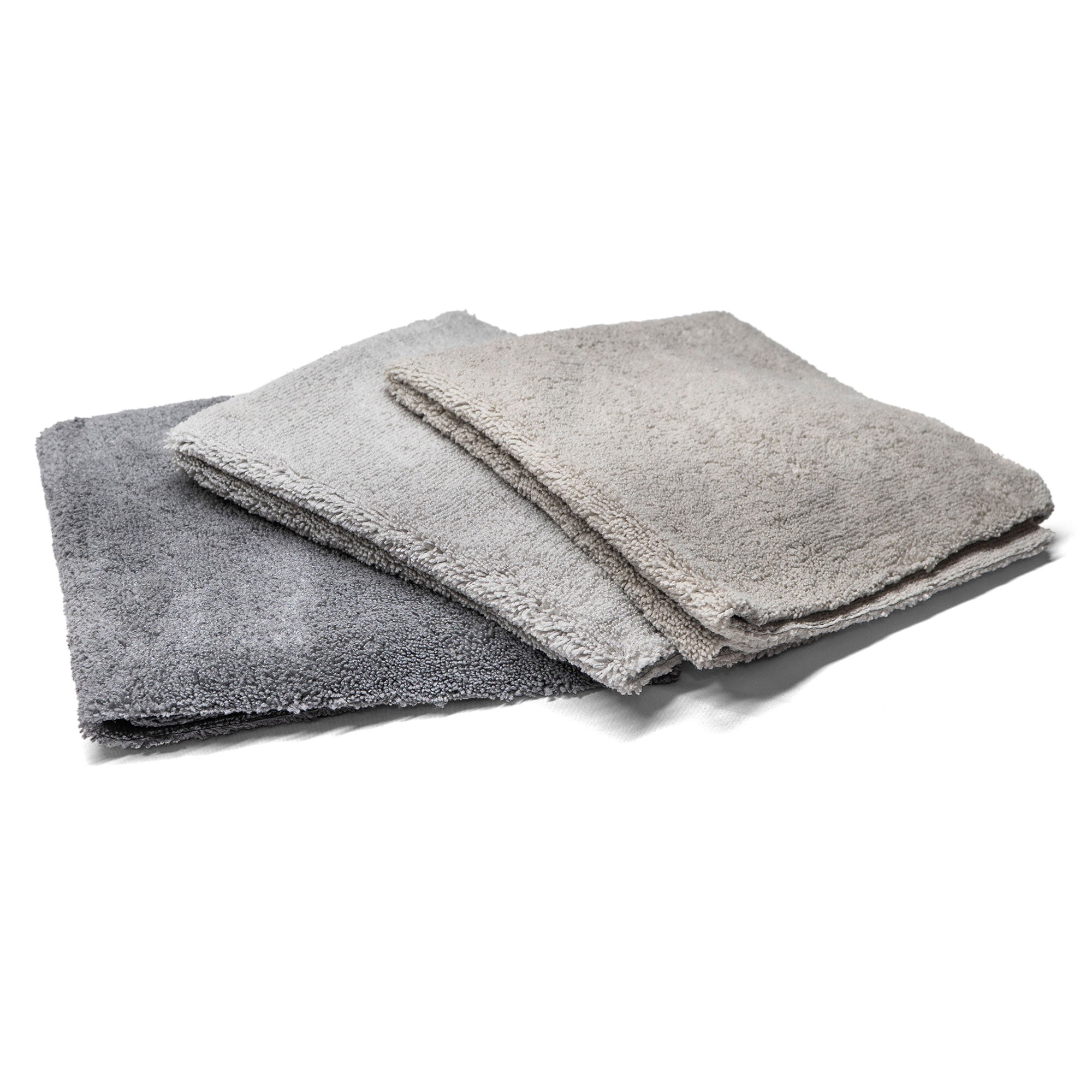 Three grey-shade microfiber towels stacked together, ideal for cleaning and detailing vehicles with a soft, absorbent texture.