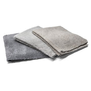 Three grey-shade microfiber towels stacked together, ideal for cleaning and detailing vehicles with a soft, absorbent texture.