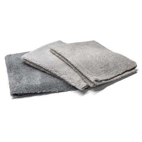 Three grey-shade microfiber towels stacked together, ideal for cleaning and detailing vehicles with a soft, absorbent texture.