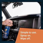 A person spraying Interior Sauce on a vehicle dashboard, demonstrating easy application for cleaning.