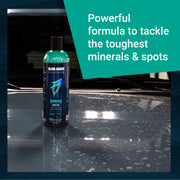 Premium Spots Sauce bottle on a car hood, designed to remove tough minerals and spots for a flawless finish.