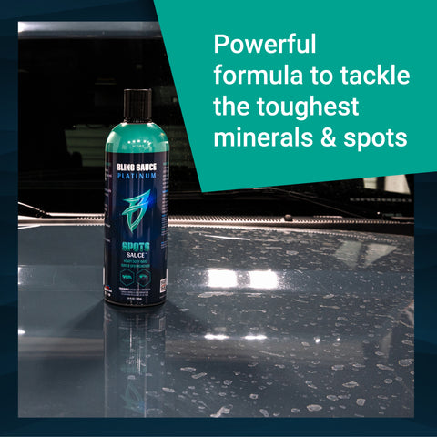 Premium Spots Sauce bottle on a car hood, designed to remove tough minerals and spots for a flawless finish.