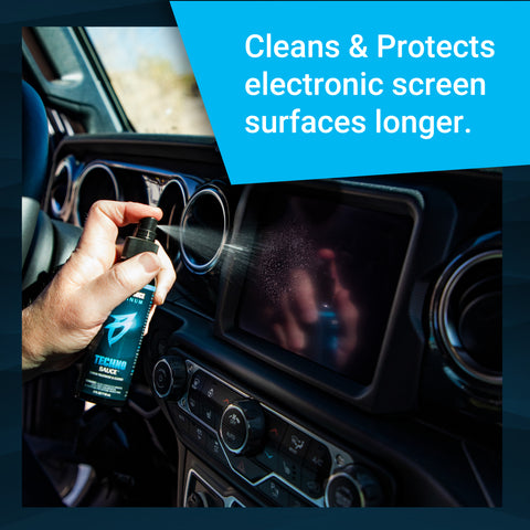A person sprays Techno Sauce on a vehicle's electronic screen, showcasing its cleaning and protective features.