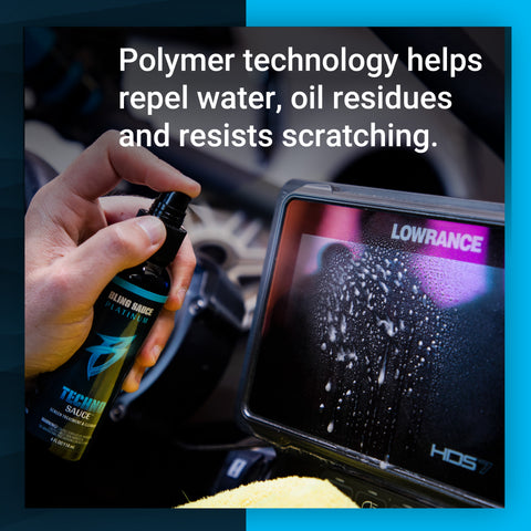 Hand holding a bottle of Techno Sauce, demonstrating water-repellent properties on a touchscreen display in a vehicle.