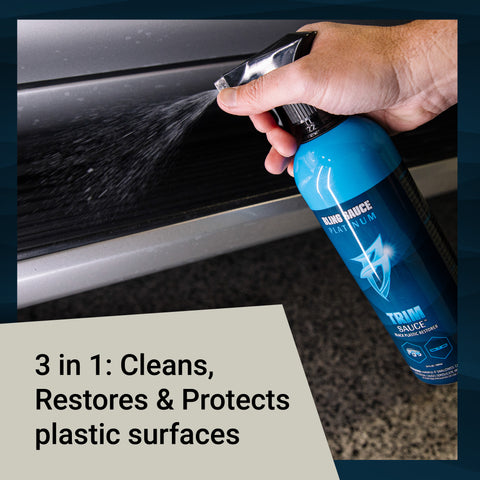 Trim Sauce bottle being sprayed on a vehicle's plastic surface, showcasing its cleaning, restoring, and protecting features.