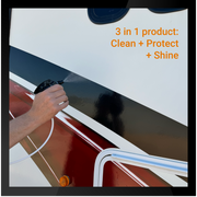 Hand spraying RV Sauce on an RV surface, showcasing its 3-in-1 cleaning, protecting, and shining capabilities.