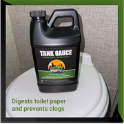 Bottle of Tank Sauce enzyme-based gray water treatment for digesting toilet paper and preventing clogs, placed on a toilet.
