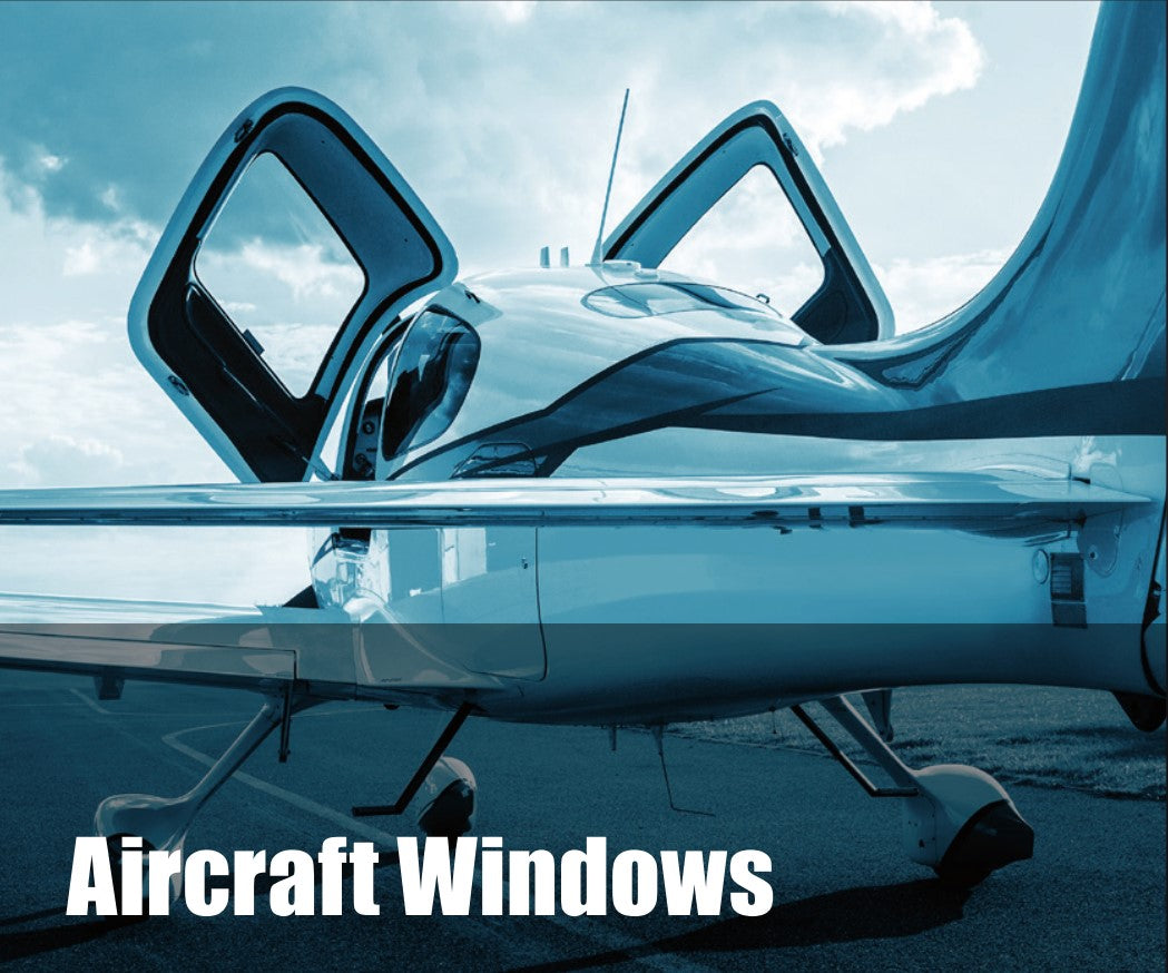 Close-up of an aircraft with open windows, showcasing sleek design and modern engineering.
